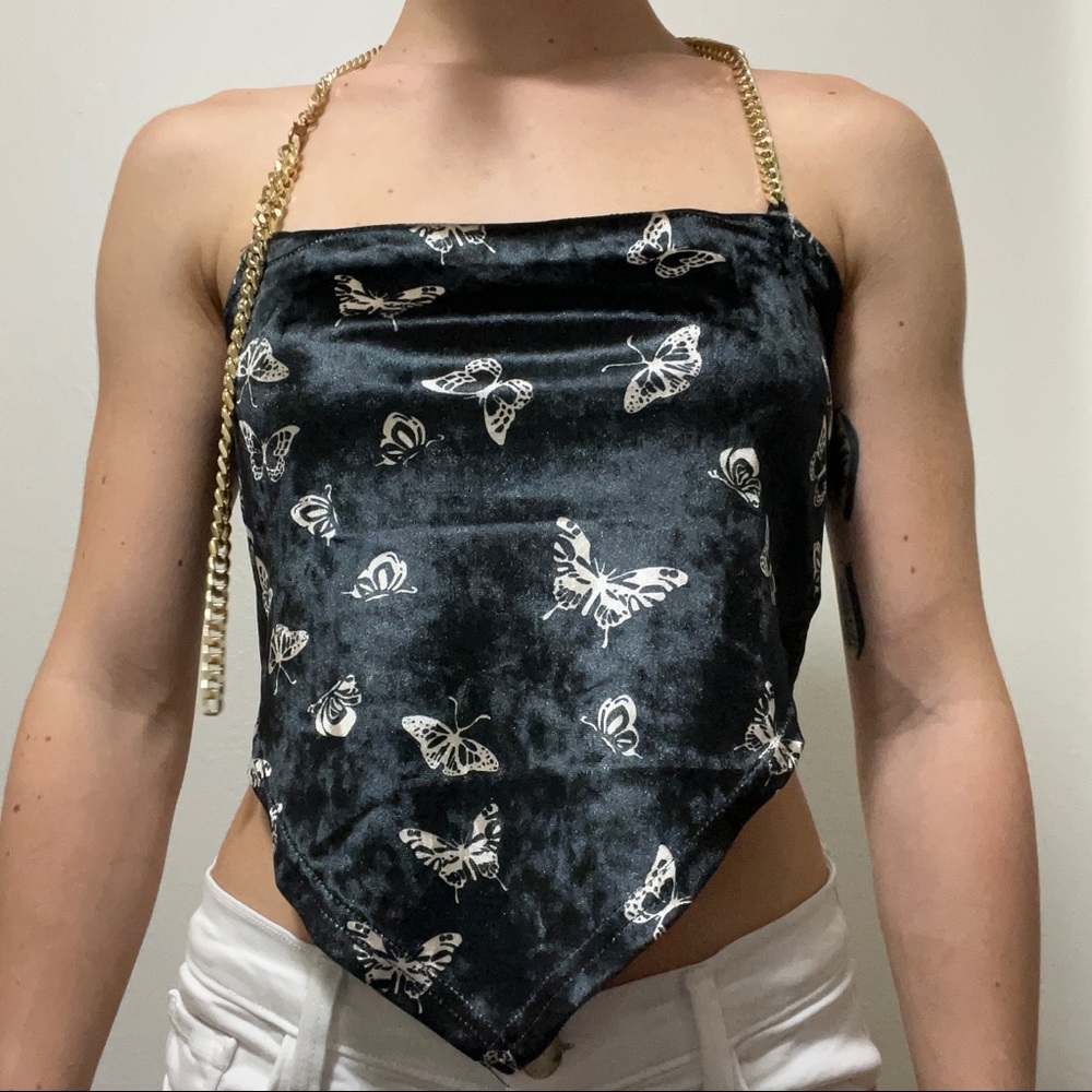 Black butterfly crop top with gold chained straps.